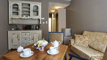 Suite Studio Junior | Coin séjour | TV connectée