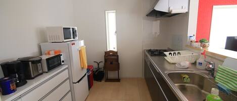 Fridge, microwave, cookware/dishes/utensils