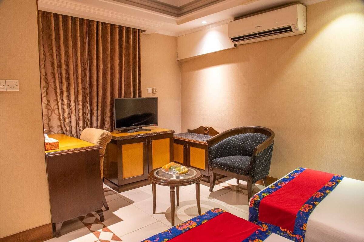deluxe twin room | in-room safe, laptop workspace, blackout curtains, soundproofing