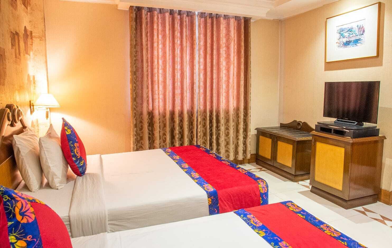 deluxe twin room | in-room safe, laptop workspace, blackout curtains, soundproofing