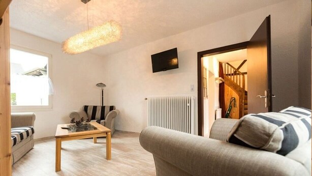 Traditional Chalet, 3 Bedrooms, Non Smoking, Ground Floor (incl. final cleaning fee 95 EUR) | Living area | 45-inch LCD TV with satellite channels, TV - Chalet Dattenfeld - In Windeck (Rhein-Sieg-Kreis District) (Windeck)