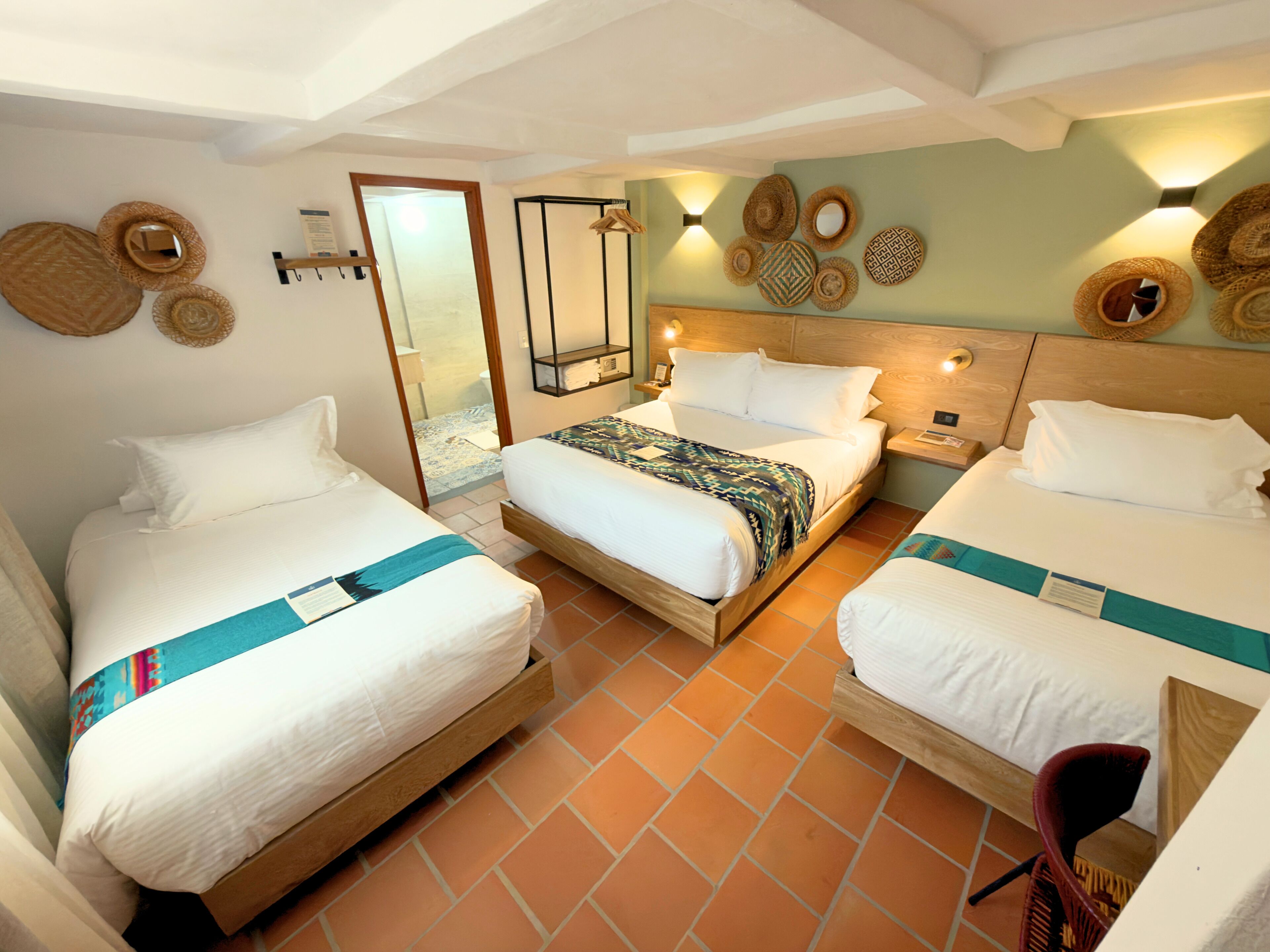 Deluxe Quadruple Room, Courtyard View | Down comforters, desk, iron/ironing board (on request), WiFi (free)