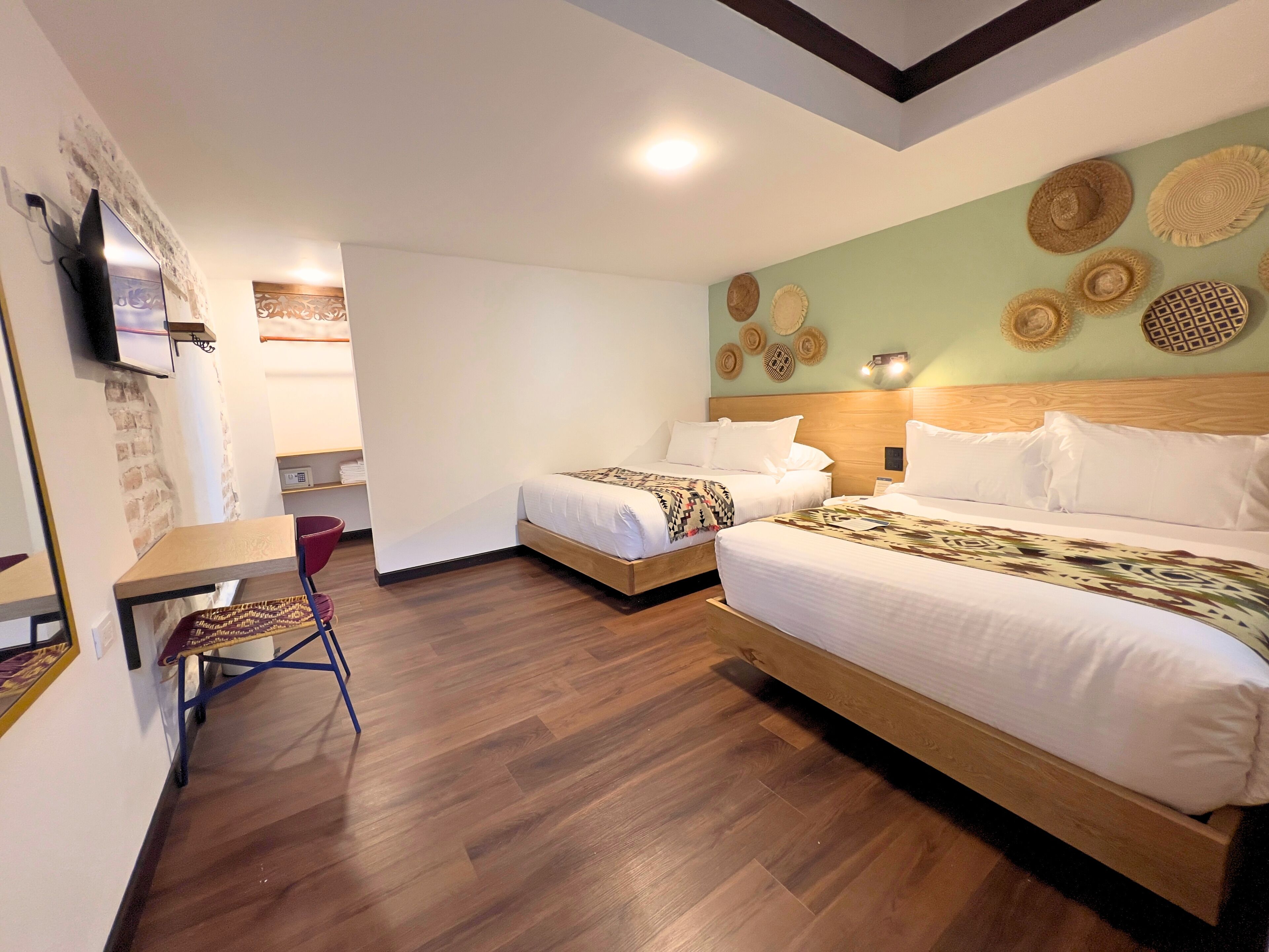 Standard Quadruple Room, Courtyard View | Down comforters, desk, iron/ironing board (on request), WiFi (free)