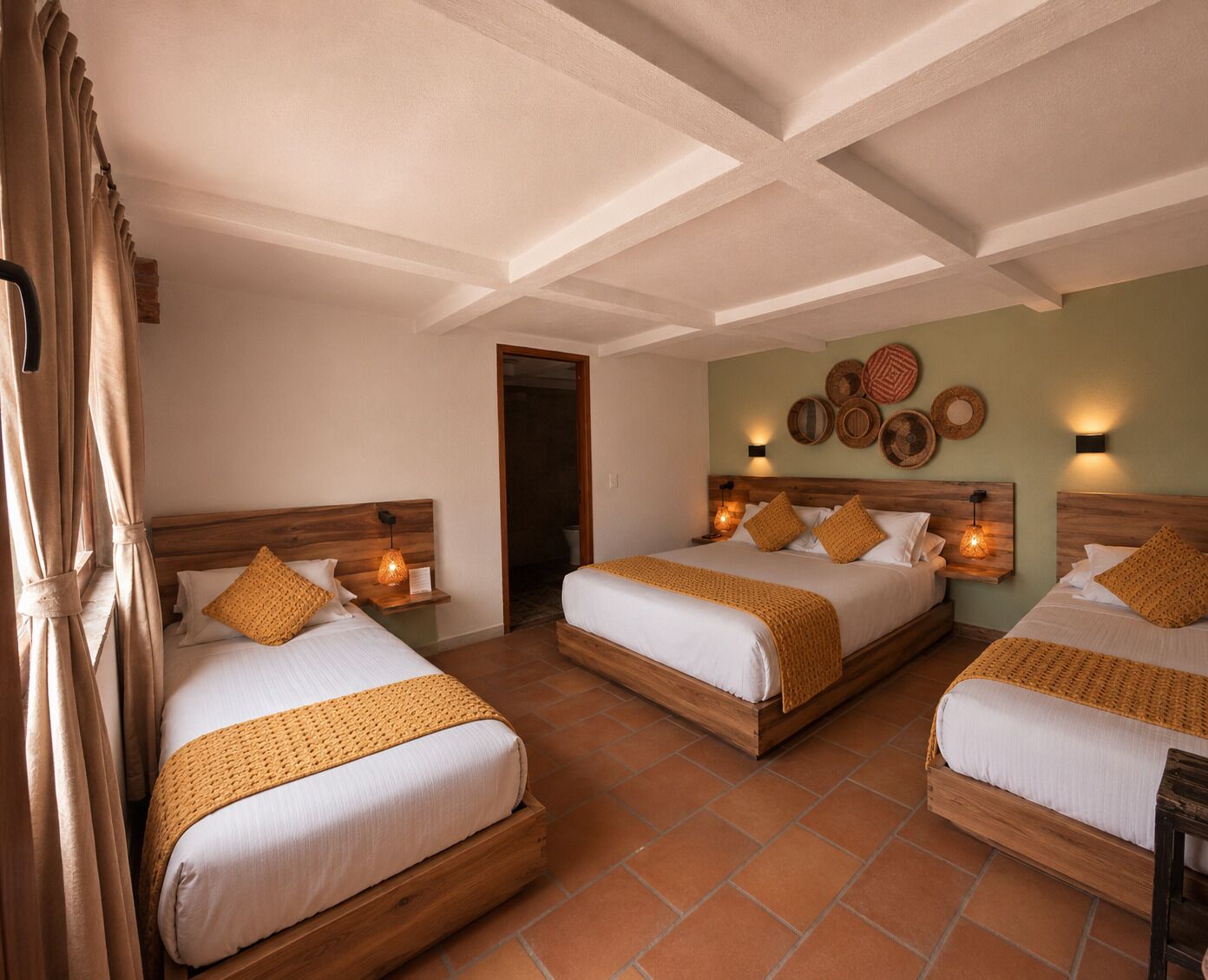 Deluxe Quadruple Room, Courtyard View | Down duvets, individually decorated, desk, iron/ironing board