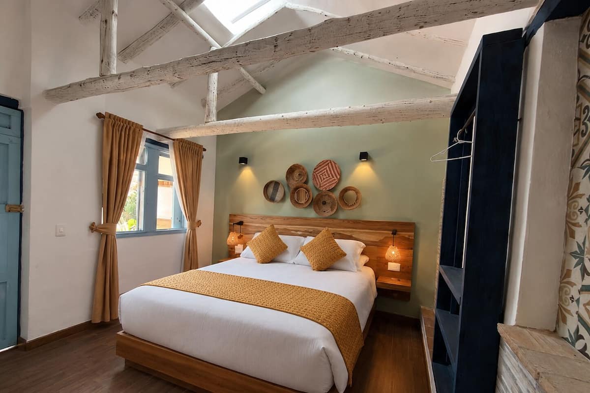 Deluxe Double Room, Courtyard View | Down comforters, individually decorated, desk, iron/ironing board