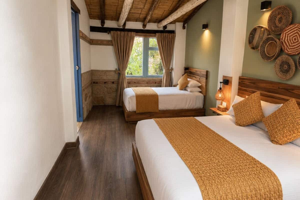 Deluxe Triple Room, Courtyard View | Down comforters, individually decorated, desk, iron/ironing board