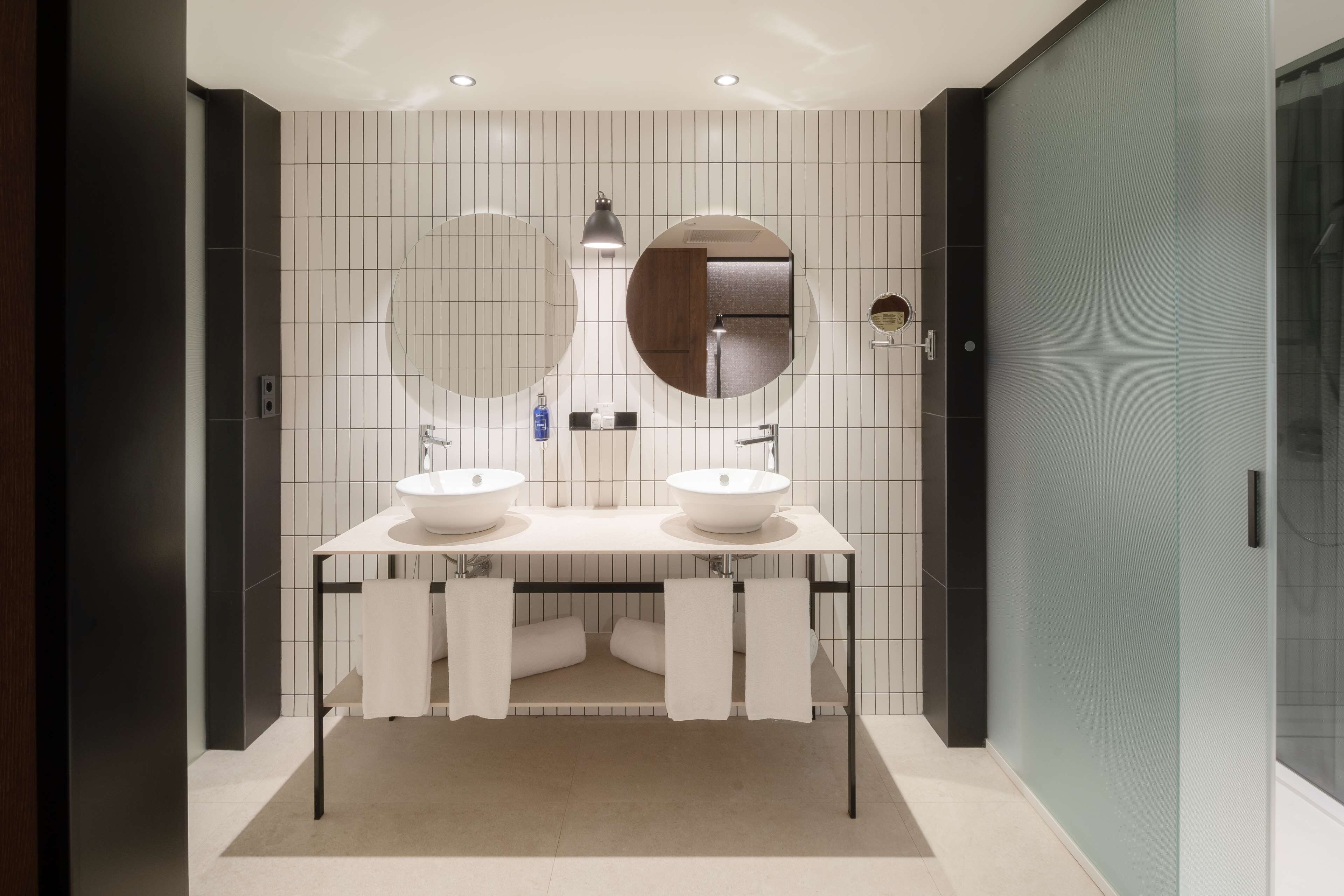 family room | bathroom | shower, rainfall showerhead, eco-friendly toiletries, hair dryer