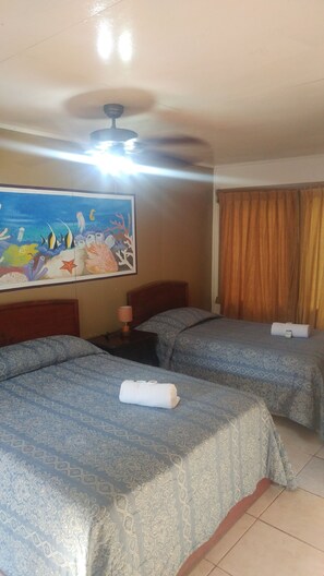 Comfort Double Room, 2 Double Beds, Non Smoking | In-room safe, individually decorated, individually furnished, desk - Hotel Nataro Inn (Roatan)
