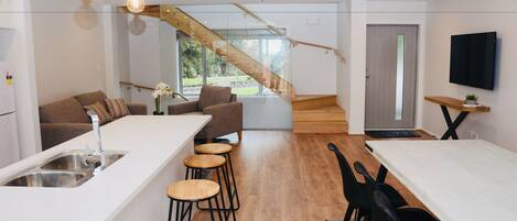 City Townhome, Multiple Beds | Private kitchen | Fridge, microwave, oven, stovetop