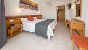 A hotel room with a bed, bedside tables, a desk, and a TV. - HOTEL PLAYASOL MARE NOSTRUM (Ibiza Town)