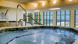 A hot tub with a view of the beach and cityscape. - The Oasis at Orange Beach  - Lazy River + Slide, Pools, Splash Pad, Cafe & Bar.. (Orange Beach)