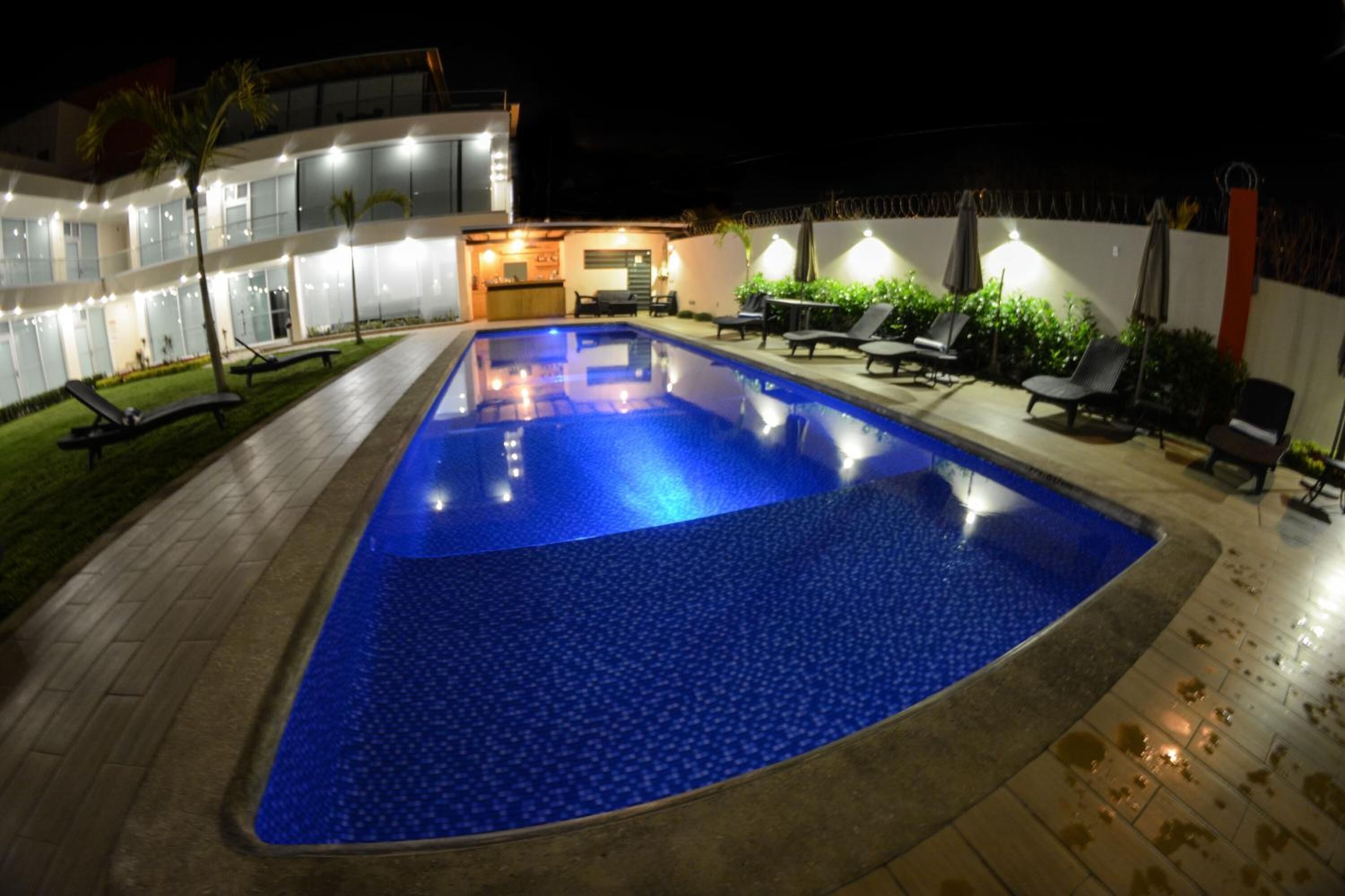 outdoor pool, open 9 am to 8 pm, pool umbrellas, pool loungers