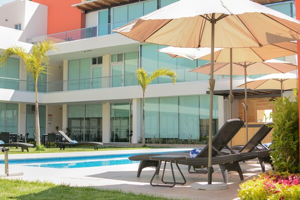 Outdoor pool, open 9 AM to 8 PM, pool umbrellas, sun loungers