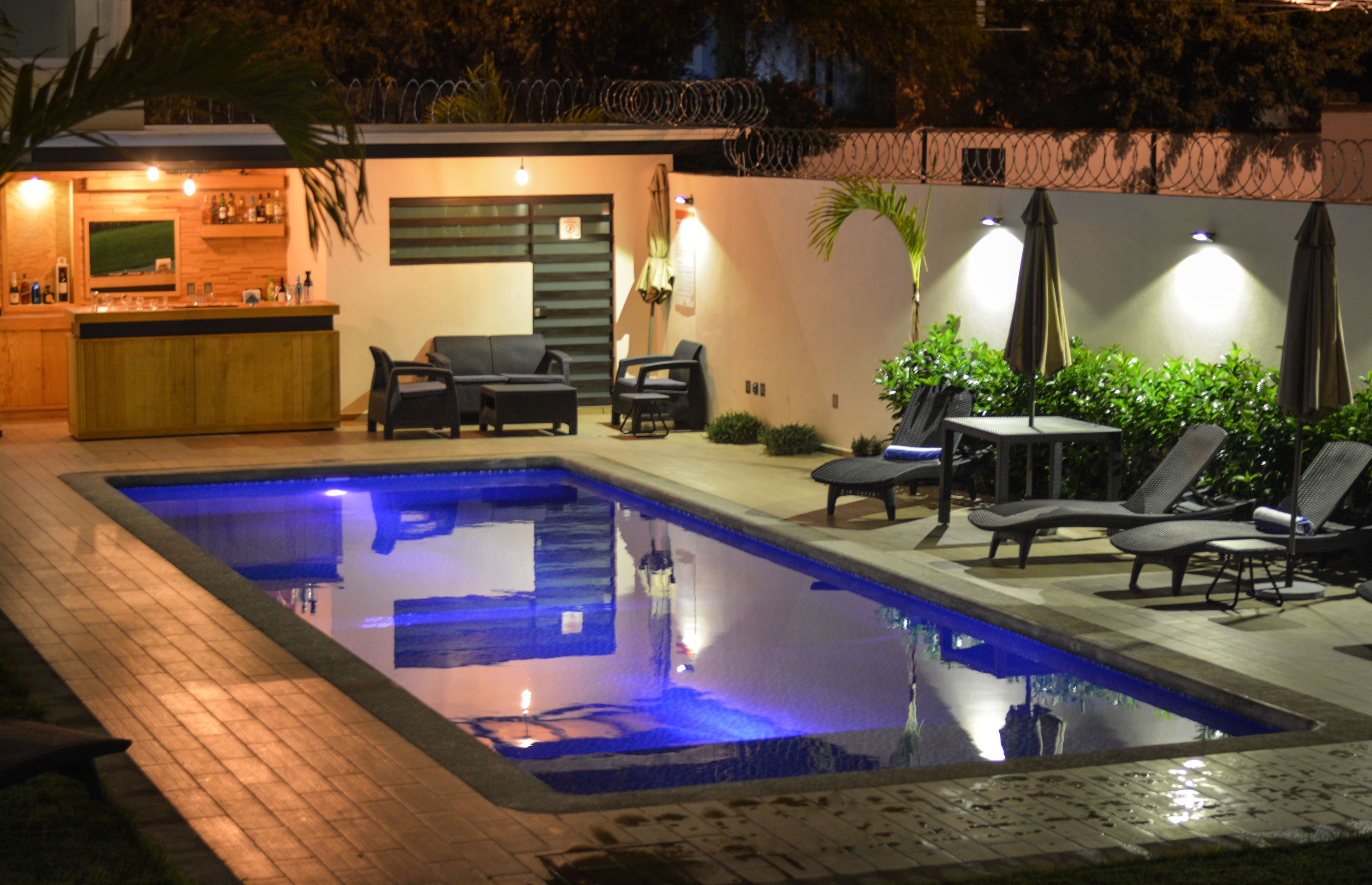 outdoor pool, open 9 am to 8 pm, pool umbrellas, pool loungers