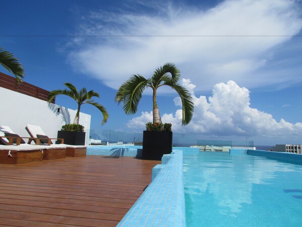 Outdoor pool, pool umbrellas, pool loungers