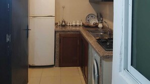 Comfort Apartment, Non Smoking | Private kitchen | Full-size fridge, microwave (on request), stovetop - Appart bel bachir (Tangier)