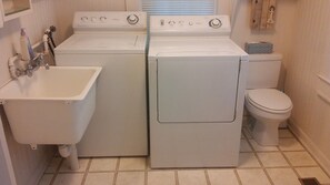 Combined shower/bathtub, towels, toilet paper