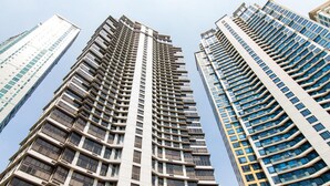 A high-rise building with a modern architectural design, featuring multiple floors and a series of balconies. - 2 Bedroom Bellagio Towers by Stays PH (Taguig)