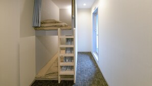 A narrow hallway with a bunk bed at the end. - bnb+ Asakusa Kuramae - Hostel (Tokyo)