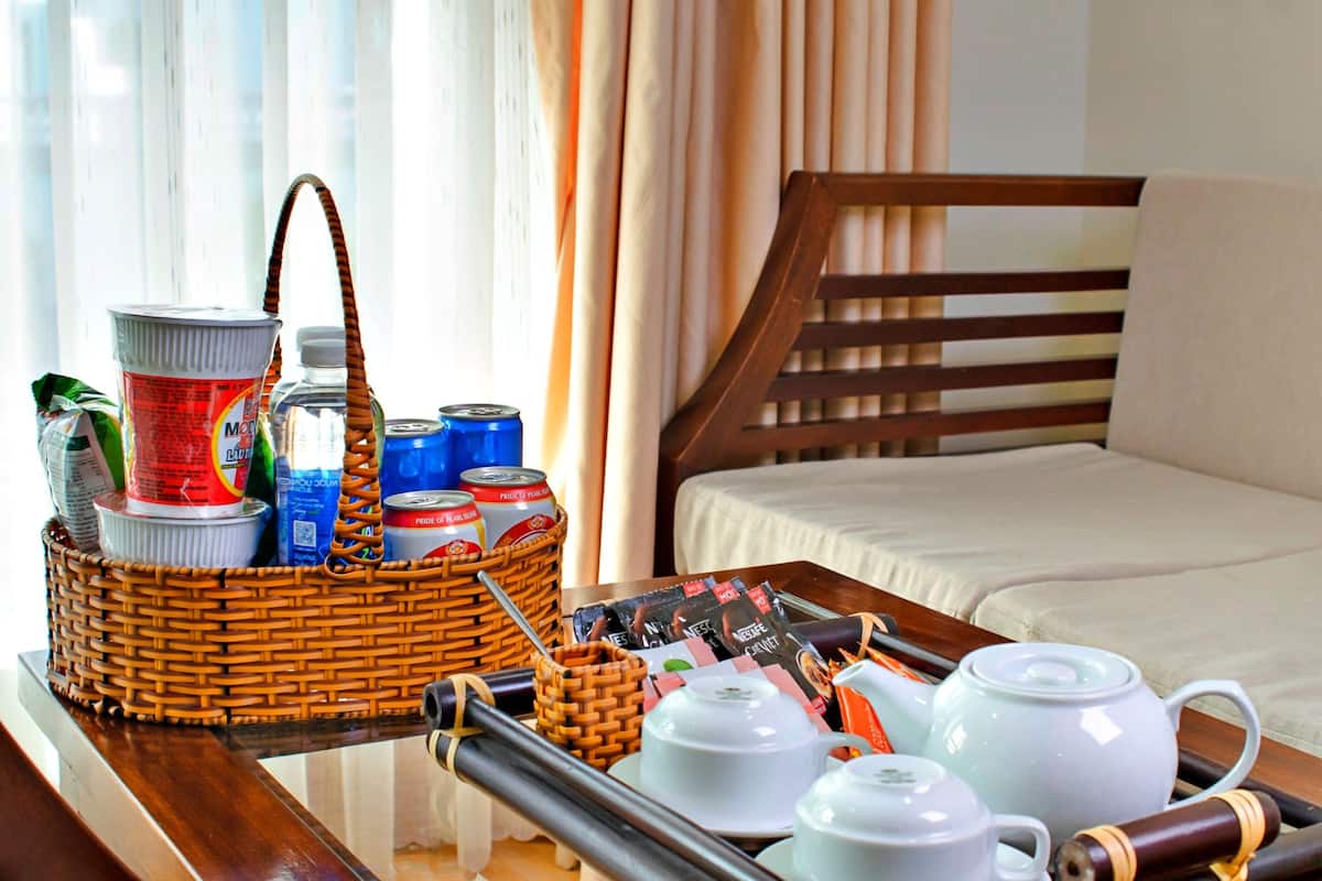 deluxe family room | premium bedding, desk, laptop workspace, blackout curtains