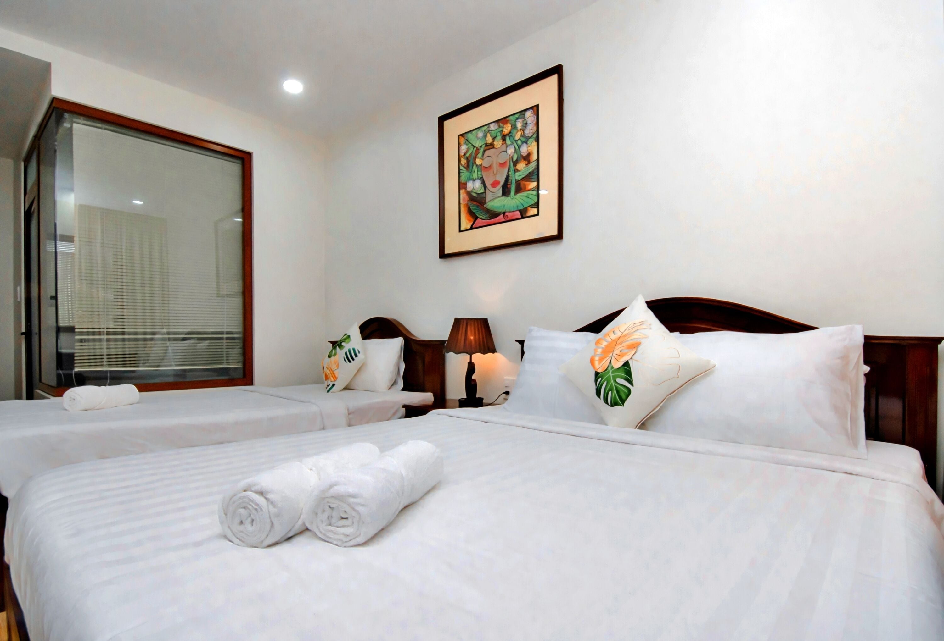 deluxe triple room | premium bedding, desk, laptop workspace, blackout curtains