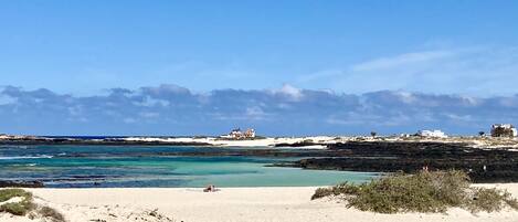 A la platja, gandules de platja i tovalloles de platja