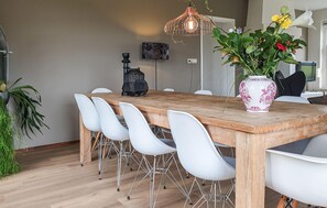 Enjoy meals in this stylish dining area with a large table and comfortable seating for six.