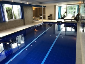 Indoor pool, open 6 AM to 9 PM, pool loungers