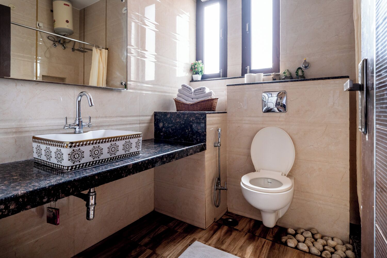 A bathroom with a white sink, a toilet, and a shower.