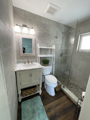 Shower, hair dryer, towels, soap