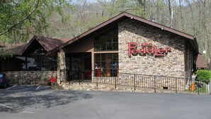 A stone building with a sign reading "The Redler." - Downtown, nice furnishings, clean and cozy w/ fireplace, indoor & outdoor pools. (Gatlinburg)