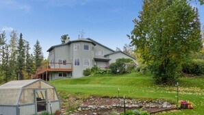 A two-story house with a covered porch and a small shed. - Mountain Vista Retreat, Excellent Views, Private entrance and living area (Palmer)