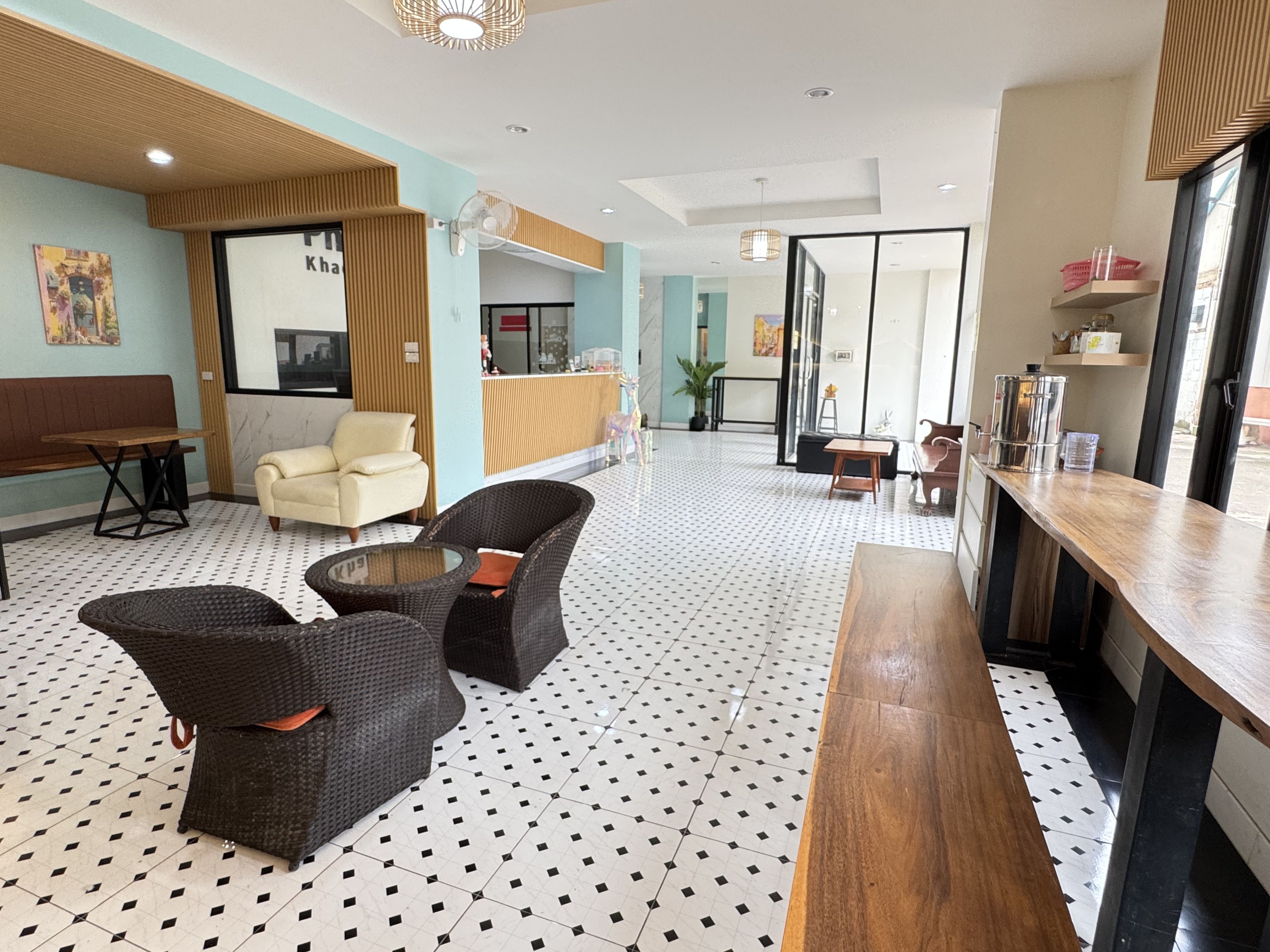 A lobby with seating areas, a reception desk, and a bar.