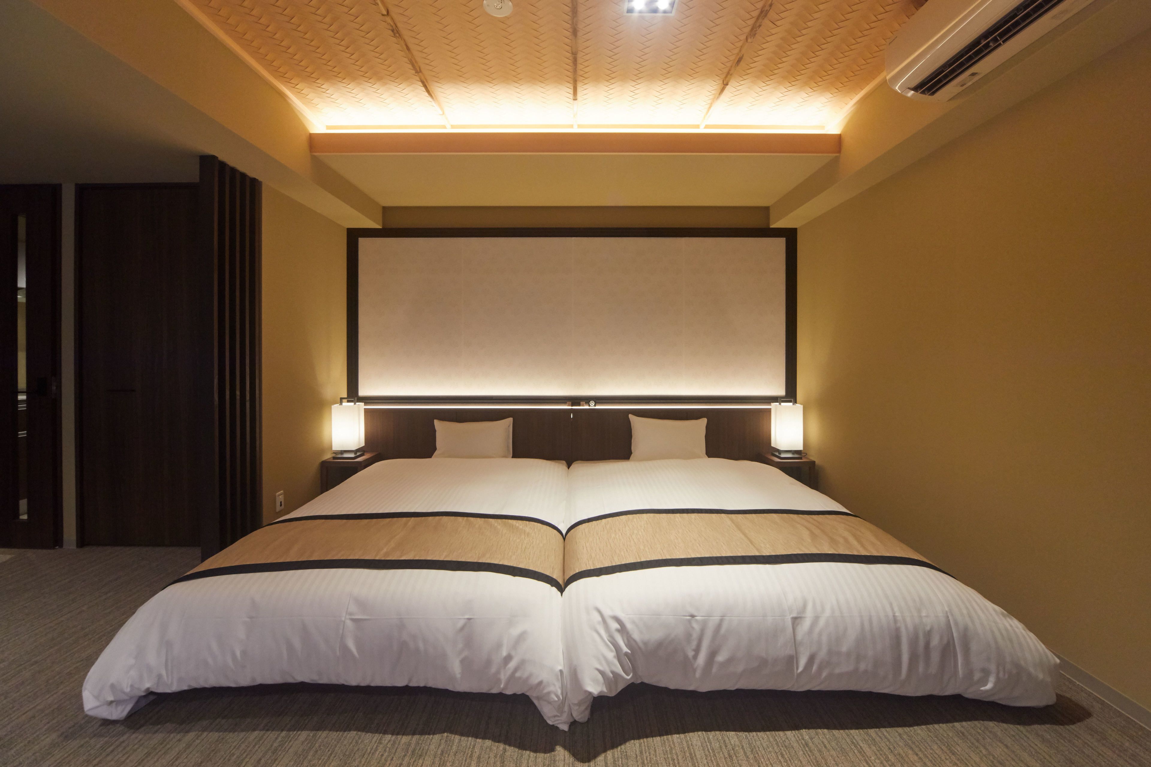 hauza premium suite room | desk, laptop workspace, blackout curtains, iron/ironing board