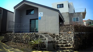 A modern building with a sign reading "The Elysia Daisy." - Daisy (Jeju City)