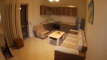 Apartamento luxo, sacada | Sala de estar | TV de tela plana