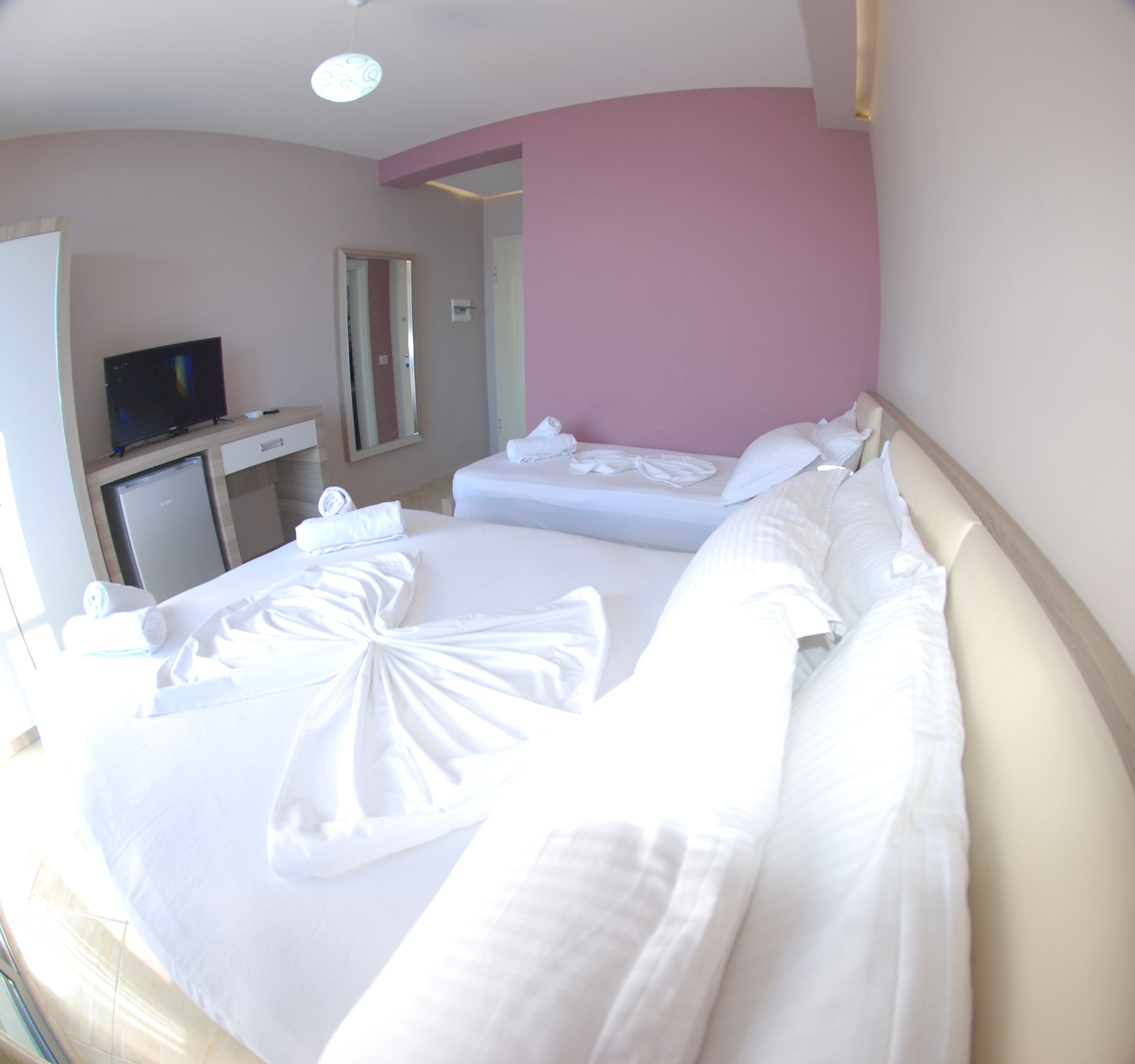 deluxe triple room, sea view | in-room safe, desk, blackout curtains, soundproofing