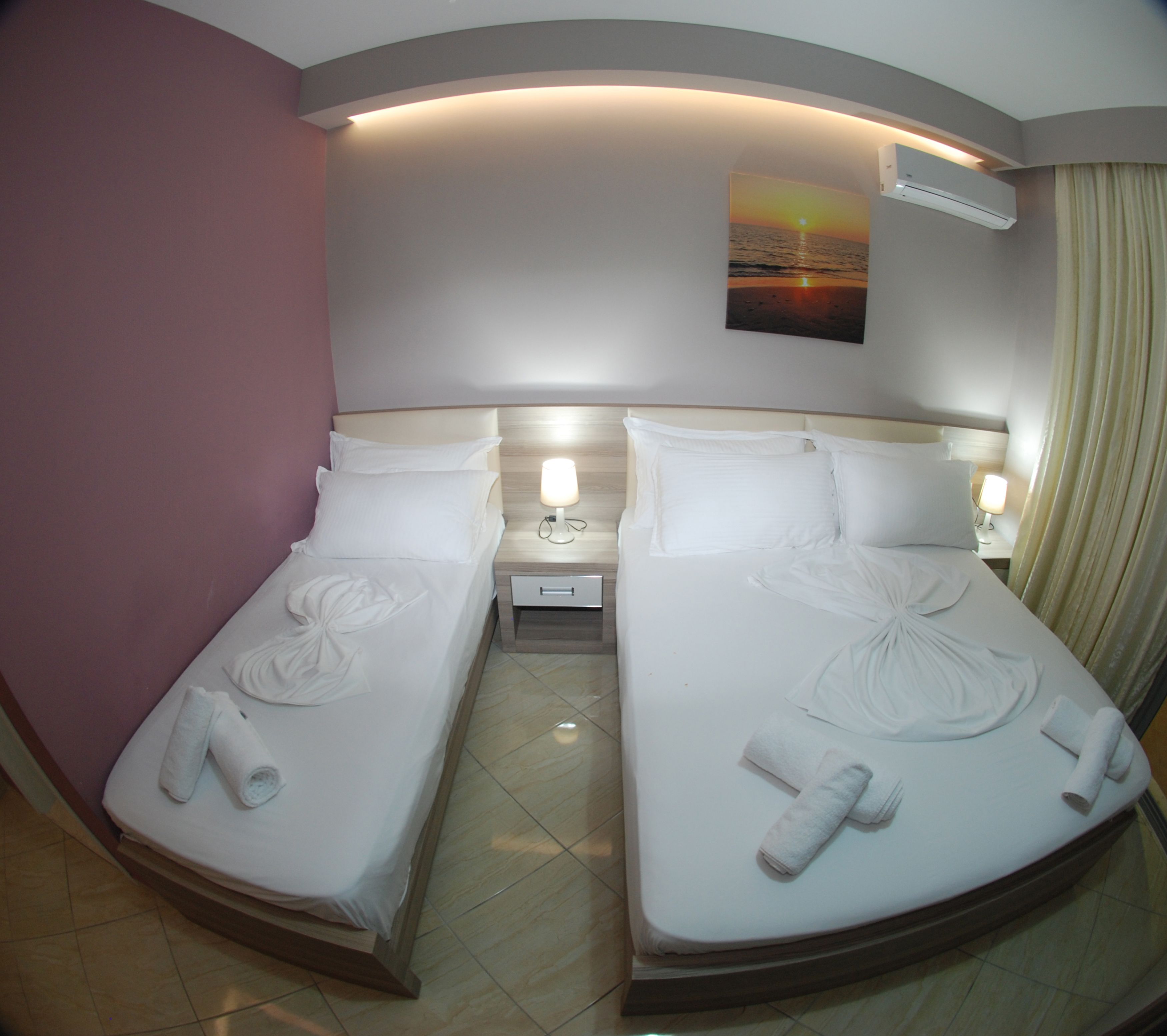 deluxe triple room, sea view | in-room safe, desk, blackout curtains, soundproofing