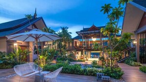 A resort with a pool, outdoor seating, and tropical landscaping. - The Scene Cliff View Villas (Krabi)