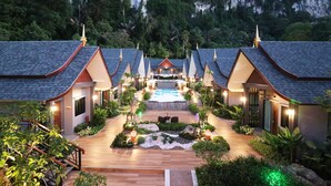 A resort with multiple buildings, a central pool, and a well-maintained garden. - The Scene Cliff View Villas (Krabi)