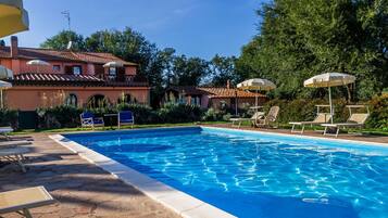 Seasonal outdoor pool, open 8:30 AM to 7:30 PM, pool umbrellas