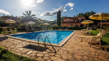 Seasonal outdoor pool, open 8:30 AM to 7:30 PM, pool umbrellas