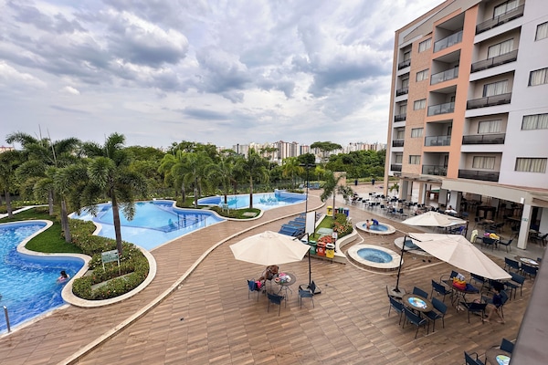 5 indoor pools, outdoor pool, open 7 AM to 11 PM, pool umbrellas