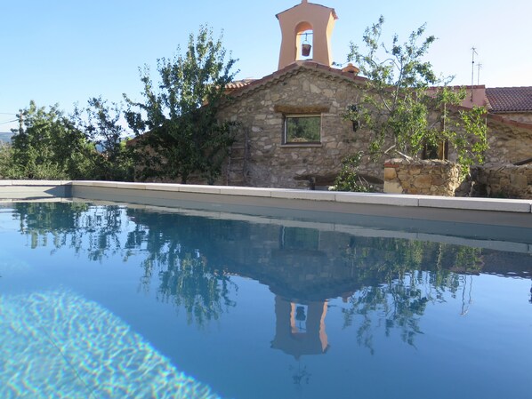 Seasonal outdoor pool, pool loungers