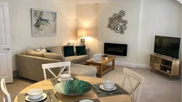 Apartment, 2 Bedrooms | Living area | Flat-screen TV