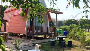 A small, single-story house with a red roof and a porch. - Romsiri Resort (Sung Noen)