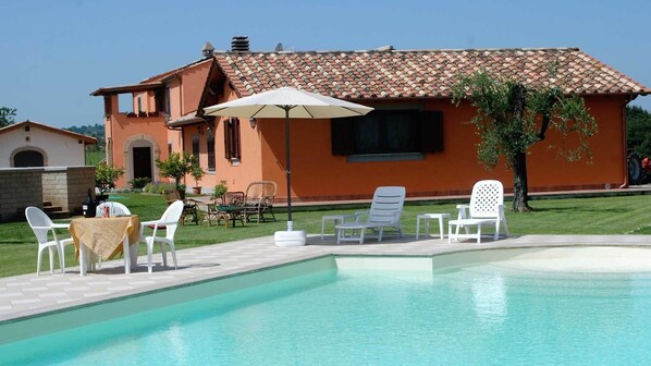 Outdoor pool, pool umbrellas, pool loungers