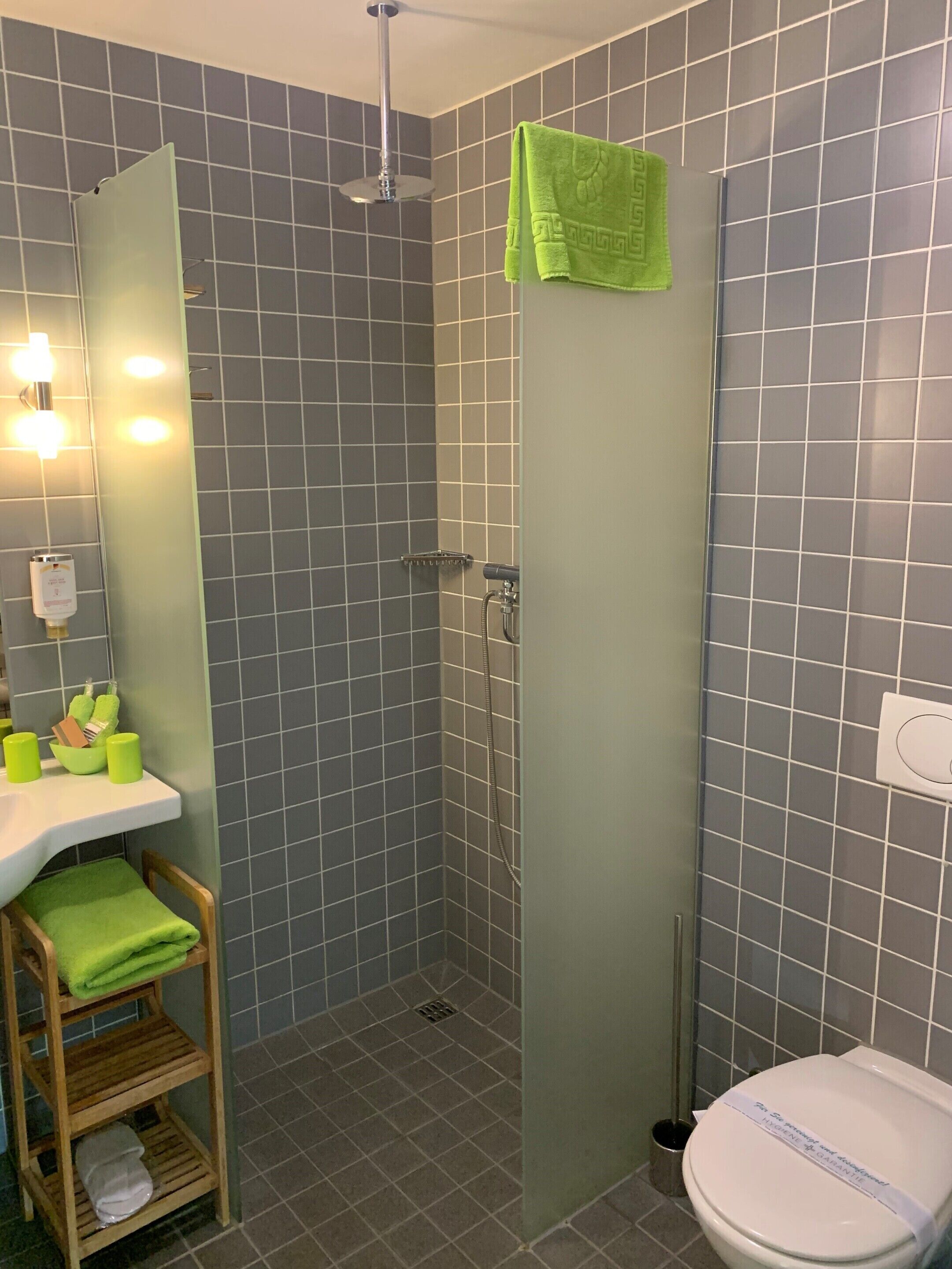 rainfall showerhead, eco-friendly toiletries, hair dryer, slippers