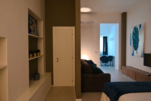 Superior suite | Woonruimte | Flatscreentelevisie