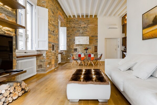 Luxury Suite, Multiple Beds | Living area | TV